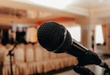 black microphone in light conference hall