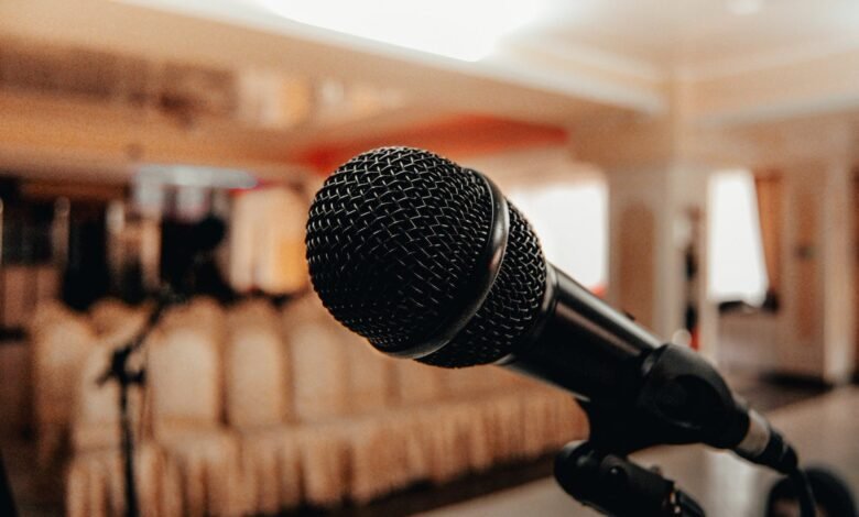 black microphone in light conference hall