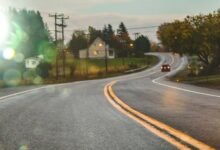 Car driving on road in evening