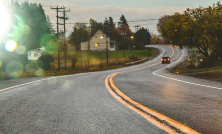 Car driving on road in evening