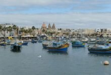 ships anchored by old city