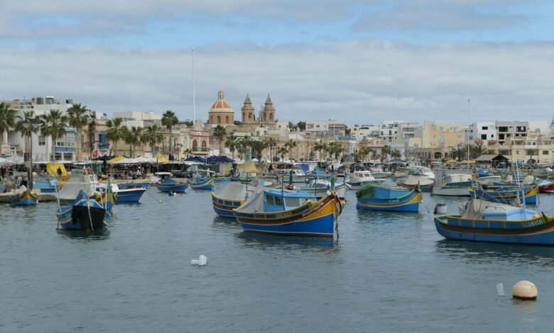 ships anchored by old city