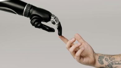 bionic hand and human hand finger pointing