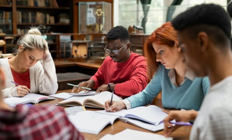 Group of university students studying together