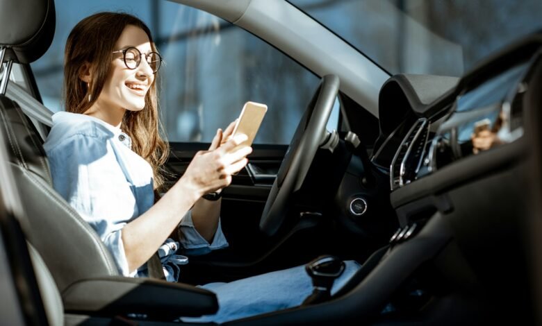 Woman with phone in the car